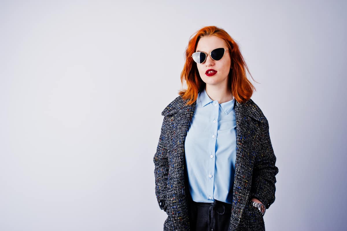 Coat, shades, blue shirt