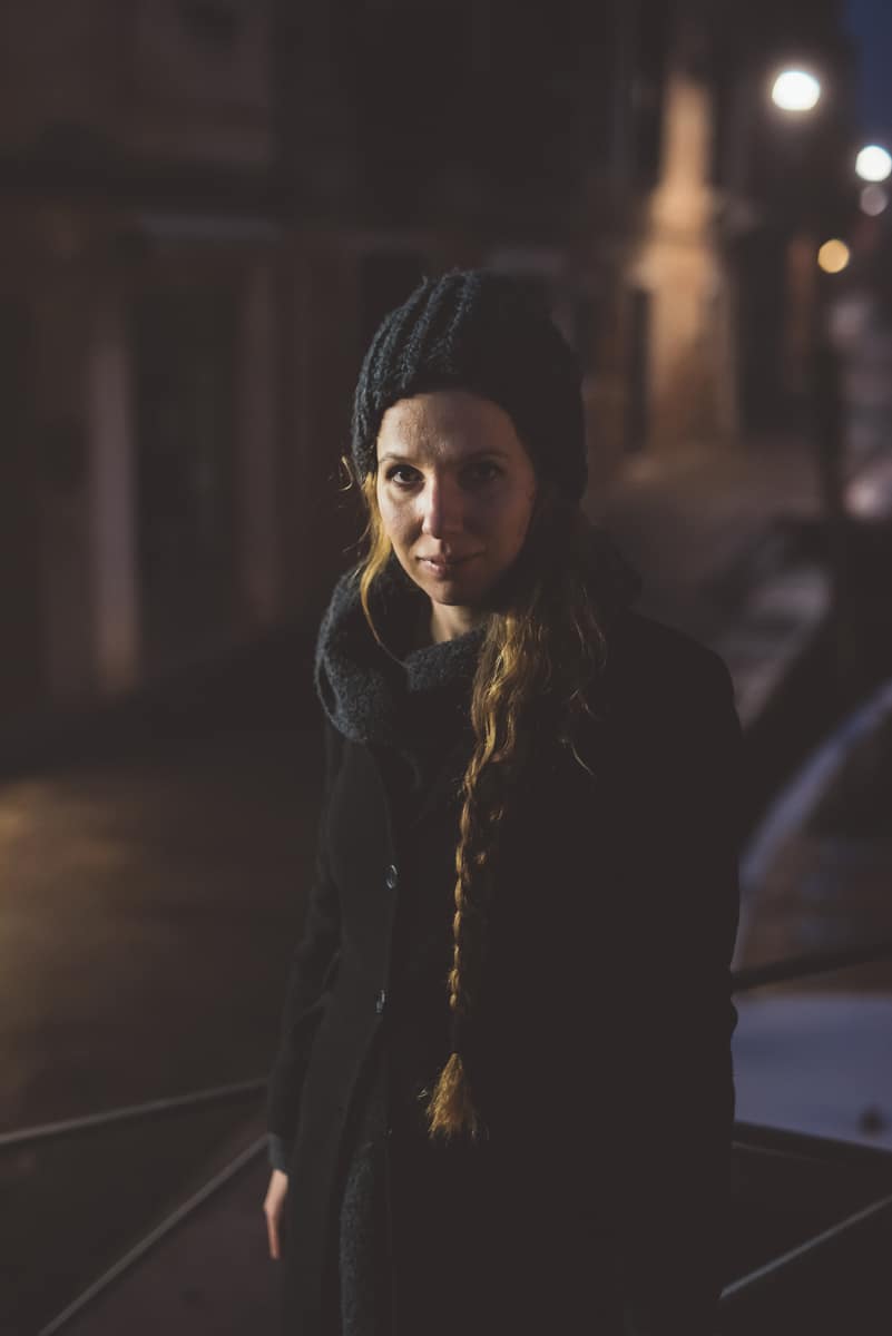 Knit hat under city lights